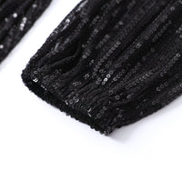 Schwarzes Paillettenkleid, glänzend, elegant, Abendmode, Detailansicht, Stoffstruktur.