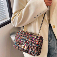 Damen Handtasche aus Tweed mit Kettenriemen und Schloss-Luzern Mode